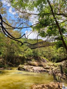 a bridge over a river with at Beyond ella in Ella