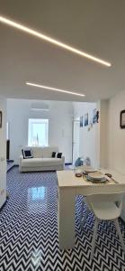 a living room with a couch and a table at VillaNina in Pontone