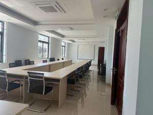 a large conference room with a long table and chairs at Hotel T88 in Ấp Trảng