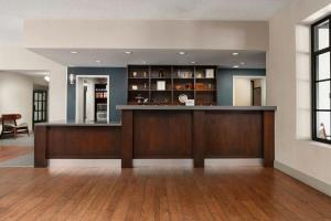 a lobby with a bar in a building at Four Points by Sheraton Pleasanton in Pleasanton