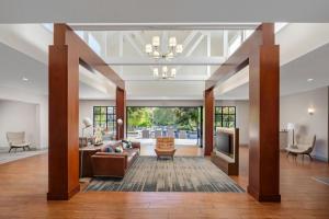 a living room with a couch and a table at Four Points by Sheraton Pleasanton in Pleasanton
