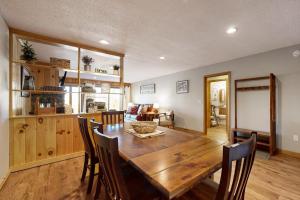 a kitchen and dining room with a wooden table and chairs at Mountain Memories in Bartlett