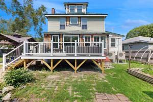 a large white house with a large deck at Salt Air Serenity in Old Orchard Beach