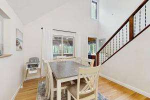 a dining room with a table and chairs at Ski & Splash Retreat in Bridgton