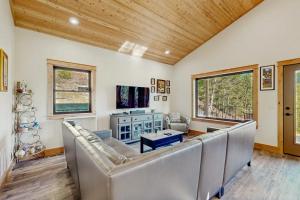 a living room with a couch and a table at Rocky Crest Retreat in Kalispell