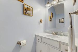 a bathroom with a sink and a mirror at Mad House in Waterville Valley +35 photos