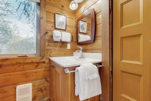 a bathroom with a sink and a mirror at Moose and Bear in Bigfork +54 photos