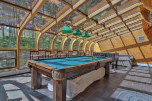 a room with a pool table in a building at Sunday River Village Timberline in Newry