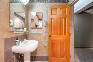 a bathroom with a sink and a mirror at Shoshone 1986 in Big Sky +42 photos