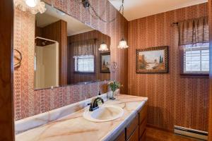 a bathroom with a sink and a mirror at South Fork Sunset in South Fork +52 photos