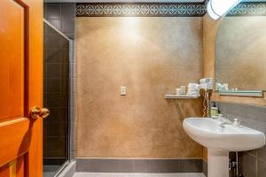 a bathroom with a sink and a shower at Shoshone 1972 in Big Sky Mountain Village +31 photos
