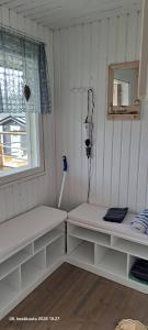 a room with white shelves and a window at Suvikoti in Lokalahti