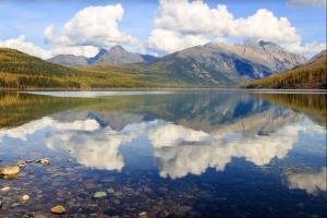 a large body of water with mountains in the background at Mountain View Escape in Big Sky