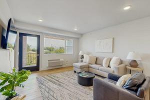 a living room with a couch and a table at Mod Haus 2 in Kalispell