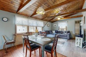 a living room with a table and a couch at Sea Rose in York Beach +29 photos