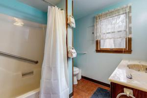 a bathroom with a shower and a sink and a toilet at Sea Rose in York Beach