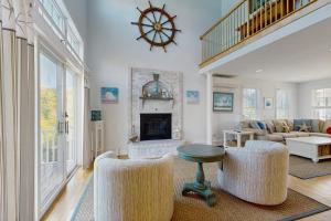 a living room with a couch and a fireplace at York Starfish Haven in York