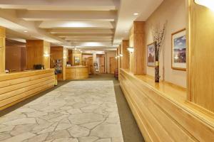 a large lobby with wood paneling and a large tile floor at Shoshone 1960 in Big Sky +50 photos