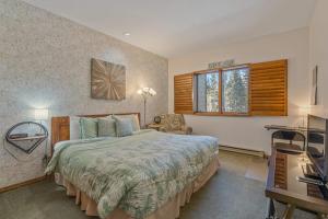 a bedroom with a large bed and a window at The Aspen Glow in Durango Mountain Resort +37 photos