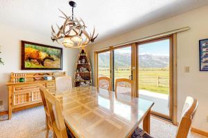a dining room with a table and a large window at 4412 Mackinaw in Wilson