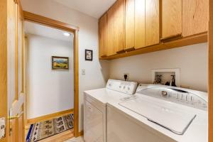 a laundry room with a washer and dryer at 4412 Mackinaw in Wilson +69 photos