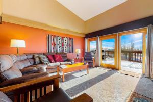 a living room with a couch and a table at Timber Ridge 4 in Teton Village +61 photos