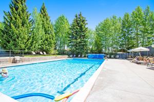 a swimming pool with a pool noodle in the middle at Timber Ridge 4 in Teton Village
