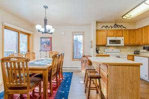 a kitchen and dining room with a table and chairs at 513 Cache in Jackson