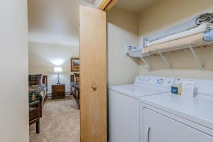 a laundry room with a washer and dryer and a bedroom at 513 Cache in Jackson +43 photos