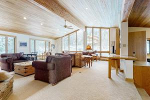 a living room with couches chairs and a table at The Clymer House in Teton Village