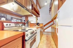 a kitchen with a stove and a refrigerator at 3622 Winterberry in Wilson