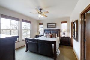a bedroom with a bed and a ceiling fan at Deer Track Retreat in Granby