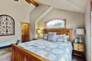 a bedroom with a large bed and a window at The Antlers 401 in Winter Park