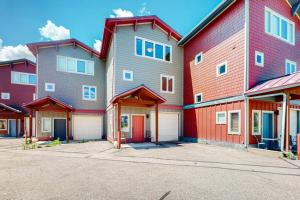 a row of houses with red and gray at WinterStar E-2 in Fraser