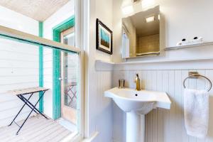a bathroom with a sink and a window at Old Town Cottage in Steamboat Springs +53 photos