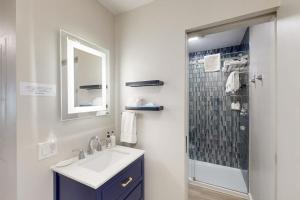 a bathroom with a sink and a shower with a mirror at 2404 Pitchfork in Jackson +47 photos