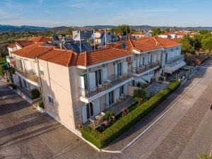 an overhead view of a large house with orange roof at Arisvi All Seasons Hotel in Skala Kallonis