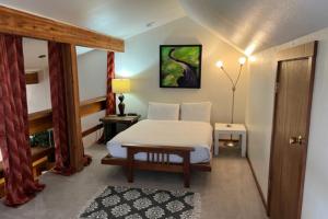 a bedroom with a bed and a table and a door at Lake Creek 1323 in Wilson