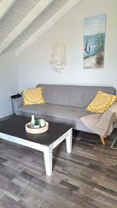 a living room with a couch and a table at Studio ISABEL in Sálakos