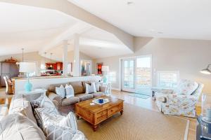 a living room with a couch and a table at Sunset View in Wells