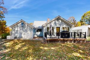 a house with a screened porch and a yard at Our Home on a Hill in Bethel