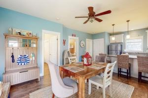 a kitchen and dining room with a table and chairs at Wells Wonder in Wells