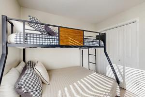 a bedroom with two bunk beds in a room at Morning Sun 2061B in Big Sky