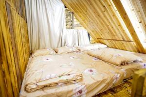 a bed in a room with a canopy at Sameer Mountain View Cottage in Tanah Rata