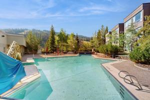 a large swimming pool in a yard at Shoshone 1917 in Big Sky