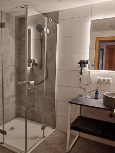 a shower with a glass door in a bathroom at Haus Resi in Berwang +65 photos