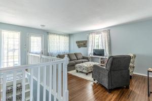 a living room with a couch and a chair at Cozy Escape in Bigfork