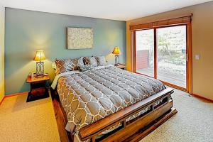 a bedroom with a large bed and a window at Snowcreek 791 in Mammoth Lakes +88 photos