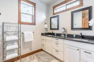 a bathroom with a sink and a mirror at Fox Trail in Columbia Falls +74 photos