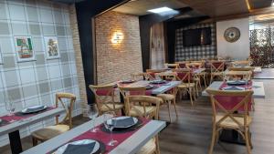 a row of tables and chairs in a restaurant at Hotel SPA GBC Avenida Pontevedra in Pontevedra +17 photos
